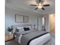 Cozy bedroom with a ceiling fan, gray walls and ample natural light at 375 Thomas Arnold Rd, Zebulon, NC 27597