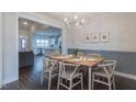 Elegant dining room featuring modern chandelier and table with seating for six at 375 Thomas Arnold Rd, Zebulon, NC 27597