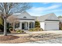 Charming single-story home with manicured landscaping and a two-car attached garage at 627 Aylestone Dr, Cary, NC 27519