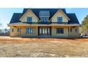 Spacious two-story house with black trim and a metal roof situated on a large lot at 6509 Zebulon Rd, Wake Forest, NC 27587