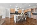 Spacious kitchen featuring a large island, stainless steel appliances, and wood cabinets at 729 Daniel Ridge Rd, Wendell, NC 27591