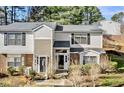 Traditional style townhome with neutral siding, black shutters, and manicured lawn at 7712 Falcon Rest Cir, Raleigh, NC 27615