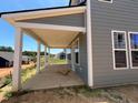 Covered outdoor patio with view of the neighborhood at 79 Willow Cameron Way, Angier, NC 27501