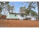 A lovely one-story home with light green siding and a well-maintained lawn at 809 S Plum St, Durham, NC 27701
