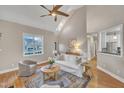 Cozy living room with high ceilings, lots of natural light, a comfortable seating area and views of the neighborhood at 8116 Hartwood Glen Cir, Willow Springs, NC 27592