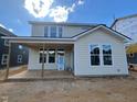 Back exterior of a two-story home with lots of natural light at 89 Willow Cameron Way, Angier, NC 27501