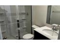 Clean bathroom featuring a glass-enclosed shower, modern fixtures, and a vanity with a sink at 937 Emmer St, Rolesville, NC 27571