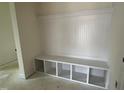 Mudroom features a custom built-in bench and storage cubbies, offering organization and style at 98 Willow Cameron Way, Angier, NC 27501