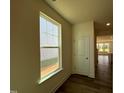 Window looking out on property with view of kitchen and dining area at 98 Willow Cameron Way, Angier, NC 27501