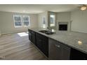 Gourmet kitchen island features a double sink and stainless steel dishwasher at 111 Magnolia Run Way, Benson, NC 27504