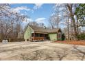 Charming exterior view of a craftsman home with a large concrete driveway at 111 Preakness Dr, Archer Lodge, NC 27527