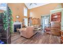 Bright living room with vaulted ceilings, fireplace and hardwood floors at 111 Preakness Dr, Archer Lodge, NC 27527