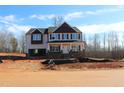 Charming two-story new construction home with covered front porch and an attached two car garage at 1414 Reading Ct # 91Kl, Burlington, NC 27217