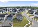 Desirable neighborhood featuring new construction homes on tree-lined streets with sidewalks and pristine landscaping at 15 Nimble Way # 175, Clayton, NC 27520
