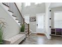 Elegant foyer with hardwood floors, staircase, and stylish decor at 213 W Weatherford Dr, Angier, NC 27501