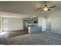 Bright and airy living room with a breakfast bar and open to a large window and back patio at 223 Magnolia Run Way, Benson, NC 27504