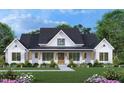 Beautiful home exterior with manicured lawn, covered porch, and stylish black and white color scheme, giving it modern curb appeal at 2600 Banks Rd # 1, Raleigh, NC 27603
