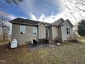 View of backyard featuring back patio with furniture and a propane tank at 2616 Pauline Oaks Dr, Franklinton, NC 27525