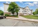 Exterior view of a condo building with well-manicured lawns and convenient parking at 3009 Winston Dr # 90, Burlington, NC 27215