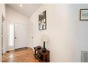 Bright entryway with parquet floors, white walls, and a small wooden accent table at 475 Beechmast, Pittsboro, NC 27312