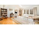 Sunlit living room featuring large windows, parquet floors, and an area rug at 475 Beechmast, Pittsboro, NC 27312