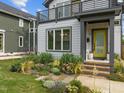 Close up of the house showcasing the landscaped front yard and a peek at the second story balcony at 5 Bart St, Raleigh, NC 27610