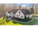 An aerial view of a single Gathering home showing the sidewalk leading to the front door and lush landscaping at 1002 Pleasant Dr, Mebane, NC 27302