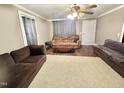 Open living area with ceiling fan and lots of space for entertaining at 1043 Cavel Chub Lake Rd, Roxboro, NC 27574