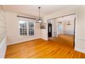 Formal dining room boasts hardwood floors, crown molding, and ample natural light at 10620 Staghound Trl, Zebulon, NC 27597