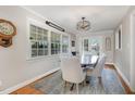 Inviting dining area with a large window, a round wooden table, and seating for six at 1107 S 2Nd St, Smithfield, NC 27577