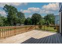 The spacious wooden deck offers space for outdoor entertaining with a view of the yard at 140 E End Ave # 2, Durham, NC 27703