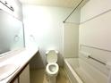 Clean bathroom featuring a vanity, toilet, and a shower-tub combo at 1430 Collegiate Cir # 102, Raleigh, NC 27606