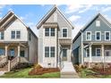 Inviting two-story home with light-blue siding and white trim, nestled between similar residences at 1662 Piney Fls Dr, Wendell, NC 27591