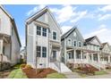 Attractive home with light-blue siding, white trim, and a well-maintained front yard and porch at 1662 Piney Fls Dr, Wendell, NC 27591