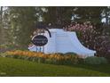 Renaissance at White Oak entrance sign surrounded by lush landscaping and colorful flowers at 207 Frosted Iris Lane St # 180, Garner, NC 27529
