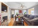 Cozy living room with fireplace, hardwood floors, and ample natural light at 209 James St, Apex, NC 27502