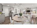 Bright living area adjacent to kitchen, showcases an open layout and modern finishes at 3402 Pelican Ln, Durham, NC 27703