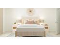 Inviting bedroom with a patterned headboard, soft lamps, decorative pillows, and an accent rug at 406 Queenstown Drive # 24, Kenly, NC 27542