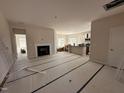 Spacious living room with fireplace and lots of natural light, adjacent to the kitchen at 45 Trescott St, Smithfield, NC 27577