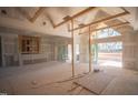 Living room area features a wall of sliding doors and large windows that fill the space with light at 7412 Wexford Woods Ln, Wake Forest, NC 27587