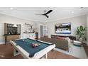Entertaining game room featuring a pool table, a cozy sofa, and a stylish wet bar area at 8621 Bishop Pine Ln, Wake Forest, NC 27587