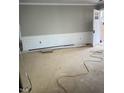 Bright living room featuring detailed wall paneling and a light-filled entrance at 1516 Bragg St, Sanford, NC 27330