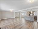 Bright open-concept living room with gorgeous floors and an adjacent island kitchen at 2605 Sumac Ln, Burlington, NC 27215