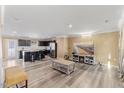 Spacious open-concept with hardwood floors connects the living room to the modern kitchen with stainless steel appliances at 1004 Bridgewater Dr, Durham, NC 27704