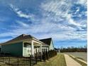 Great backyard view of a home with a covered patio, perfect for relaxation and entertainment at 1113 Hudson Dr, Mebane, NC 27302