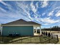 A lovely fenced-in backyard perfect for outdoor enjoyment; home has a covered patio at 1113 Hudson Dr, Mebane, NC 27302