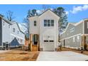 Charming two-story home boasts a modern design and inviting curb appeal with well-manicured landscaping at 1215 Chaney Rd, Raleigh, NC 27606