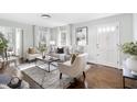 Cozy living room with hardwood floors, stylish furnishings, and ample natural light at 2204 Guess Rd, Durham, NC 27705