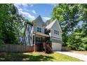 Well-maintained home featuring a welcoming front porch and attached garage at 2209 Woodnell Dr, Raleigh, NC 27603