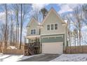 Charming two-story home featuring a cozy front porch and a two-car garage at 2209 Woodnell Dr, Raleigh, NC 27603
